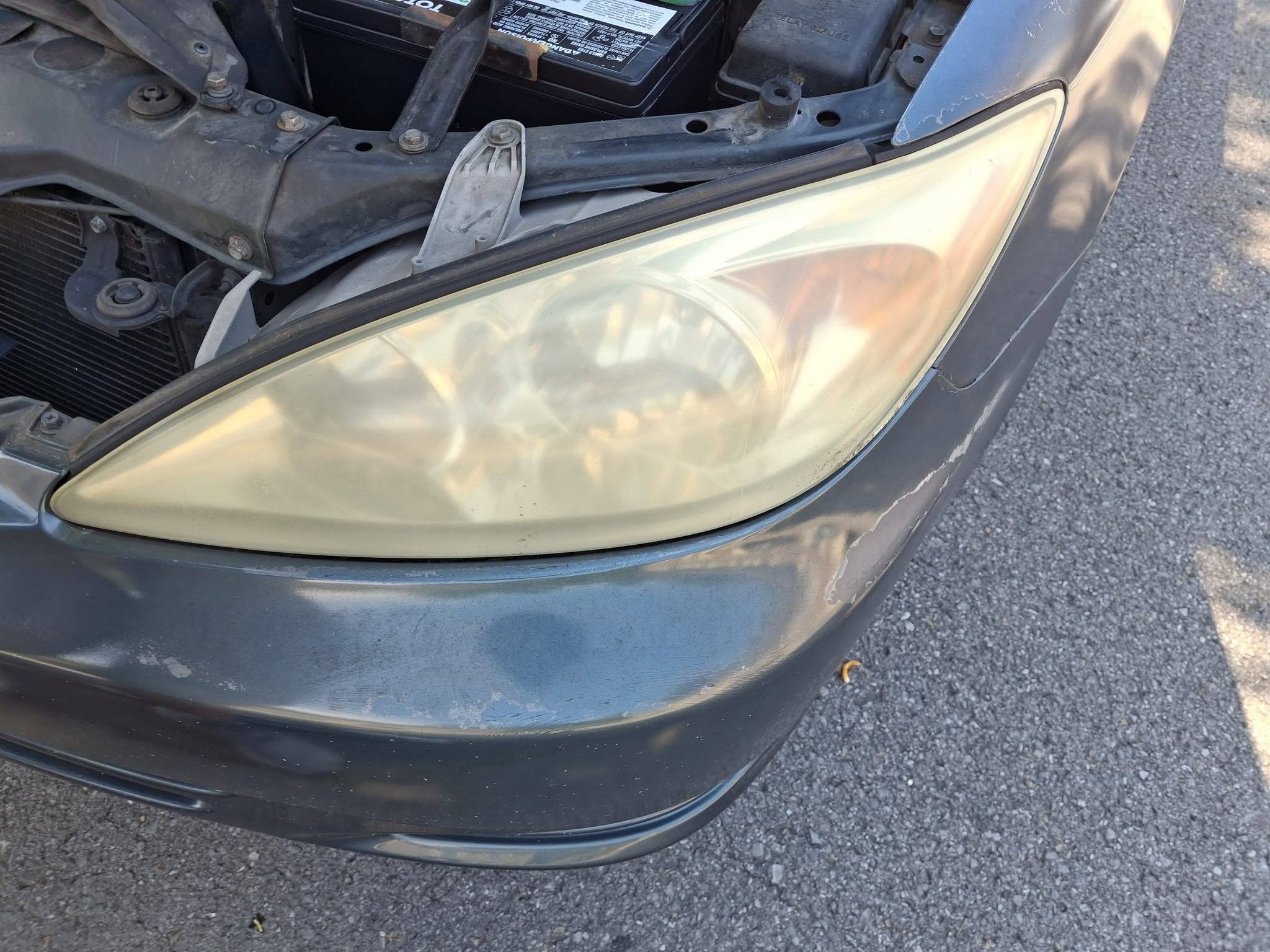 Badly yellowed and hazy headlight before restoration