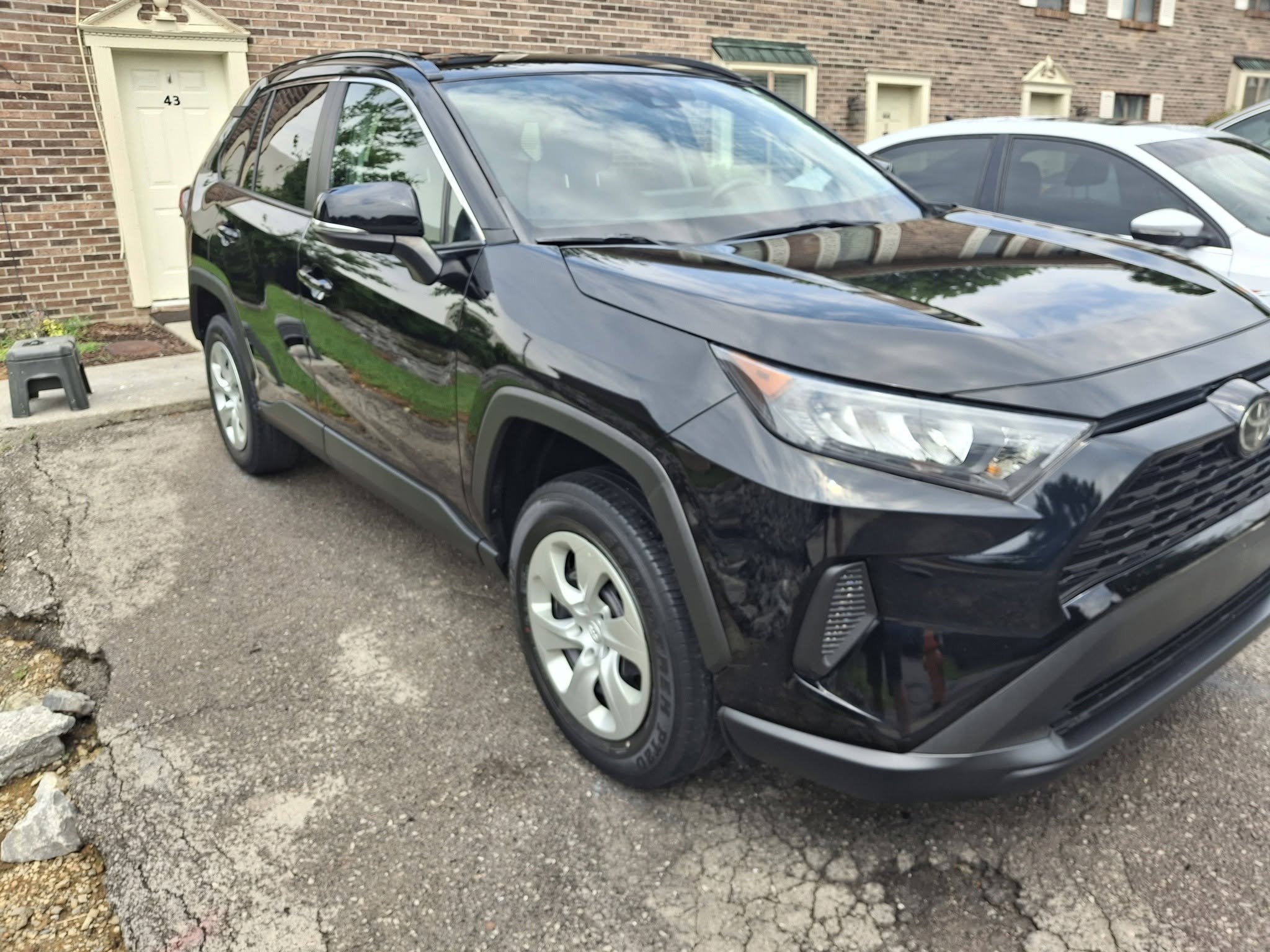 Black RAV4 finished in the client's driveway