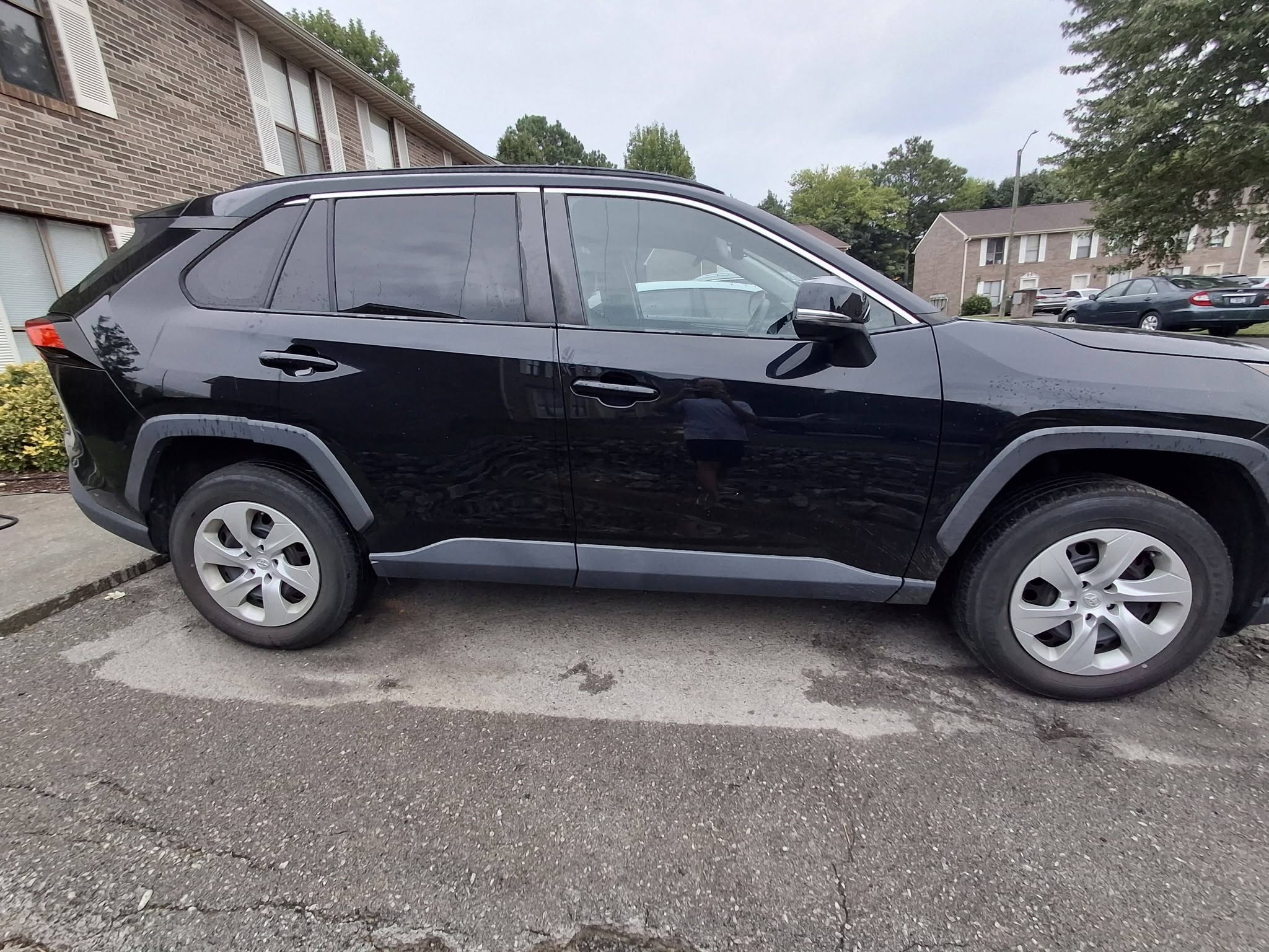 Full side profile of a detailed black Toyota RAV4