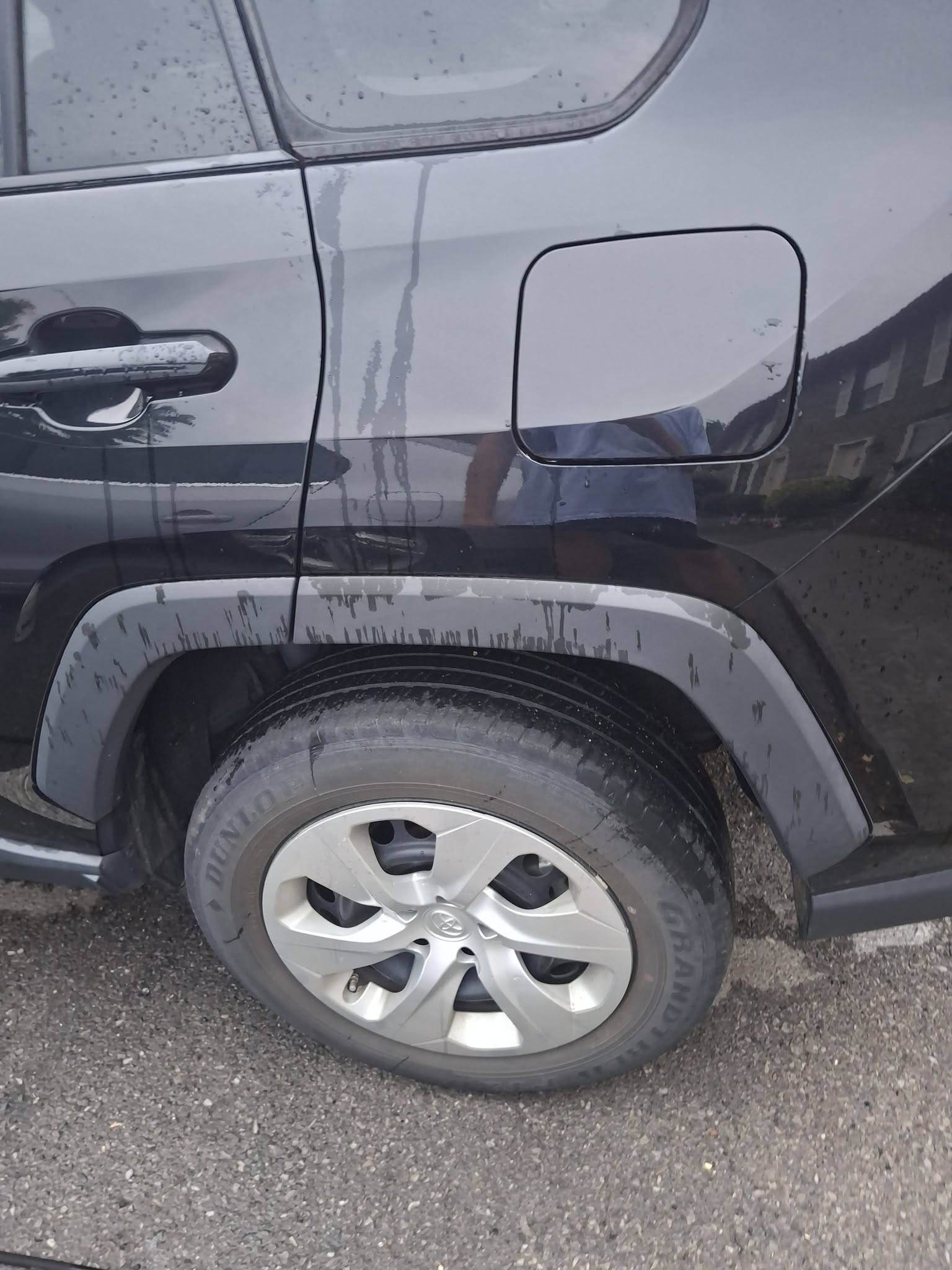 Black RAV4 mid wash with water beading off the paint